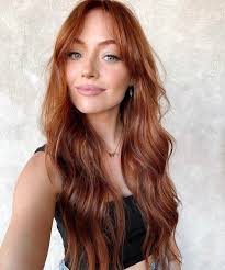 Looking for a hair stylist in Sandy, Utah that can help achieve a specific  red hair color?