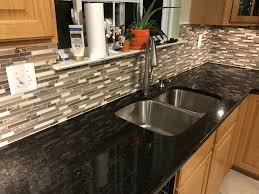 Dip metallic mosaic tiles also come in copper gold, copper bronze, and silver. Black Pearl Granite With Anatolia Tile Java Linear Mosaic Stone And Glass Wall Tile Backsplash From Lowe Updated Kitchen Granite Countertops Kitchen Backsplash