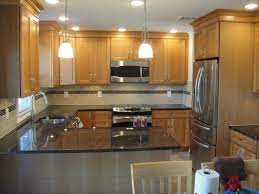 If you're not ready for a full remodel or if painting your cabinets isn't an option, then you'll love my ideas for working with what you have to create a modern kitchen with oak cabinets. Appliance Oak Kitchen Cabinets Stainless Steel Appliances Images Kitchens Black Pictures Of With White And Pics Copper Si Kitchen Cabinets Kitchen Oak Kitchen