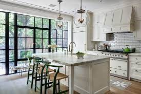 The kitchen features a cozy seating area against the far wall with framed botanicals above a french settee bench. 10 Kitchens With French Doors Ideas Kitchen Inspirations French Doors Kitchen Remodel
