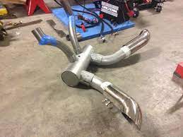 An opposed twin is not 2 singles on a common crank! New Custom Briggs Opposed Twin Exhaust