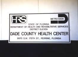 Florida Memory • View of the HRS Dade County Health Center sign following  Hurricane Andrew