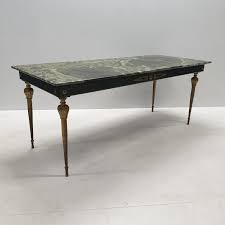Pamono's vintage coffee table collection is specialized in the midcentury modern style, but you can find any number of coffee tables suited to a variety of tastes. Vintage Brass Coffee Table With A Green Marble Top 97276
