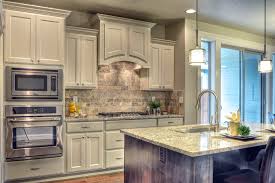 Sherwin Williams Snowbound Painted Cabinets Make The Kitchen Feel Bigger And Elegant Neutral Wall Colors White Kitchen Paint White Kitchen Paint Colors
