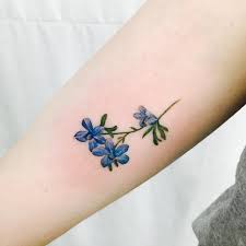 What is the symbolism of a larkspur tattoo? Siberian Larkspur On My Upper Arm Done By Wonseok At Tattoo Mare Studio Seoul Korea Larkspur Tattoo Birth Flower Tattoos Larkspur Flower Tattoos