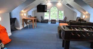 How To Transform Your Attic Into A Fun Game Room Attic Game Room Room Above Garage Bonus Rooms Above Garage
