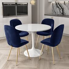 Dining room room features gray walls accented with crisp white crown molding as well as white curtains with navy blue trim on. White Round High Gloss Dining Table With 4 Dining Chairs In Navy Blue Velvet Furniture123