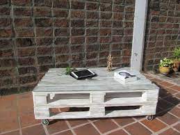 Pallet coffee tables have become staple furniture in today's modern spaces. Distressed White Pallet Coffee Table Pallet Table Decor Pallet Coffee Table Decorating Coffee Tables