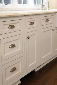 Hardware also includes the hinges that allow the cabinet door to swing open. Custom White Kitchen Cabinets With Brushed Nickel Hardware Kitchen Cabinet Handles Country Kitchen Cabinets Kitchen Handles