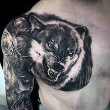 50 Realistic Wolf Tattoo Designs For Men Canine Ink Ideas Wolf Tattoo Design Realistic Wolf Tattoo Tattoo Designs Men