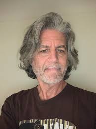 Does anyone remember the name of a male hairdresser located in the Johnson  Bldg during the 50's, 60's + ? I can't remember his name. Thanks.