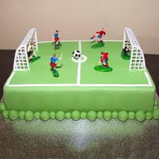 Ice the top with green icing and an icing spatula. 13 Football Cakes Designs Photo Football Field Cake Football Birthday Cake And Football Birthday Cake Ideas Snackncake