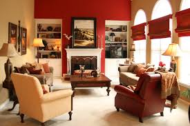 A Bold Red Accent Wall Draws You Into This Warm Gold Family Room Interior Design By Robinson Interiors Beige Living Rooms Living Room Leather Living Room Red