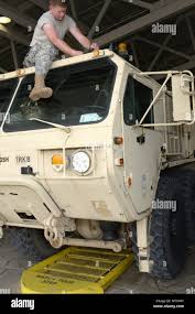 Indiana National Guard Spc. Robert Nuckles, right, and California National  Guard Sgt. Dieter Meza troubleshoot their radios at Fort Polk, Louisiana,  Wednesday, July 19, 2017. Nuckles, of Greenwood, Indiana , and Meza,