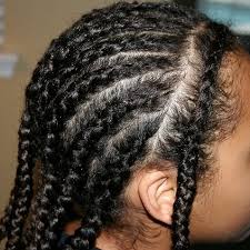 Cornrows braided into a bun. How To Braid Cornrows A Step By Step Guide