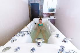 Relax and get pampered in and american standard whirlpool, air bath, or combo massage system. Premium Photo Beautiful Woman In Hydro Massage Tub At Spa Center