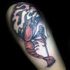 The imagination of the tattoo artist ran wild in this tattoo design as the artist showed a bird attacking a giant octopus or probably a kraken or a loch ness monster. 40 Shrimp Tattoo Designs Fur Manner Oceanic Ink Ideen Mann Stil Tattoo Tattoos Tattoo Designs Ink