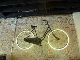 sweet georgia brown trying bikes at houndstooth road bike shop indoor bike rack bicycle art