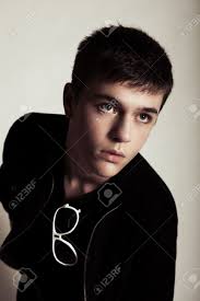 Browse 68,022 black hair model stock photos and images available, or search for black hair woman or long hair to find more great stock photos and pictures. Teenage Boy With Short Dark Hair Models For The Camera He Is Wearing A Jacket And Sunglasses Are Hanging Form His Shirt Vertical Shot Stock Photo Picture And Royalty Free Image Image