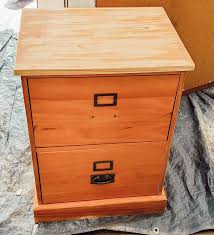 Put lace over a drawer or piece of wood, spray paint through it, leaving the painted lace design on the wood. Thrifted File Cabinet Makeover Using Stencils And Paint Hometalk