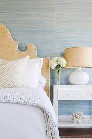 Our collection of blue wallpaper designs and solid blue wallpaper includes contemporary designer styles, dreamy prints, and graphic patterns. Blue Grasscloth Wallpaper With Gold Raffia Headboard Transitional Bedroom