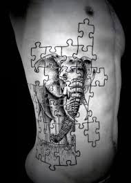 Black And White Puzzle Piece Tattoo 70 Creative Tattoos For Men Unique Design Ideas Puzzle Piece Tattoo Puzzle Tattoos Pieces Tattoo