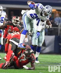 Dallas Cowboys Ezekiel Elliott Hurdles The Tampa Bay Buccaneers Defense During The First Half At At T Stadium In Arling Dallas Cowboys Cowboys Tampa Buccaneers