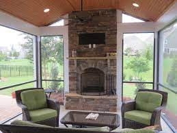 A friend screened in his porch. Screened Porch With Wood Burning Fireplace And Paver Patio Deckscapes