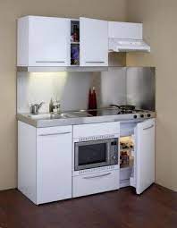 This kitchen unit houses freely moving cabinets and drawers that can serve as a table, a refrigerator, an oven, a sink and a storage space. Compact Kitchens For Small Spaces Google Search Kitchen Design Small Small Space Kitchen Small Kitchen