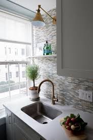 swing arm sconce over kitchen sink