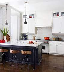 A black kitchen island pushed up against the wall doubles as a home bar in this kitchen in a small apartment remodeled by thibaut and thewood, a wood workshop based in france. Kitchen Layout Ideas Inspiration Modern Elegant Interior Designs Kitchen Design Layout Island Small Kitchen Floor Plans Small Kitchen Design Plans