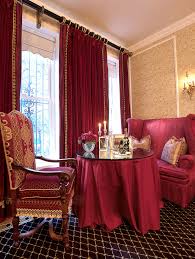 A luxurious dining room covered in elegant red walls with a gold accent lighted by two glamorous chandeliers. 15 Appealing Small Dining Room Ideas Home Design Lover