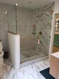 Frameless Shower Door With An Inline Notched Panel And 90 Return Panel Satin Brass Bathroom Remodel Shower Frameless Shower Enclosures Frameless Shower Doors