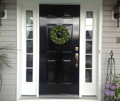 Wooden doors are classic and can be dressed up or painted to suit your preferences. Black Lacquer Front Door House Of Harper House Of Harper