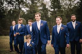 We Love This Groom S Style Dark Blue Suits With Blush Ties See More From This Sainte Terre Wedding Featured On Thekn Blush Wedding Dark Blue Suit Groom Style