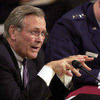 U.S. Secretary of Defense The Honorable Donald H. Rumsfeld, (foreground),  answer questions for members of the