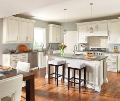 A creamy or antique white is a great neutral choice that will look good on cabinets in most kitchen spaces. Painted Oak Kitchen Cabinets Decora Cabinetry
