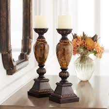 From whimsical animal candle holders to elegant filigree lanterns, there is something for every decor. Kathy Ireland Mulholland 16 H Pillar Candle Holders Set Of 2 X1946 Lamps Plus