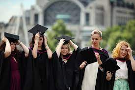 15 Graduation Cap Hairstyles That Will Look Perfect In Those Graduation Photos Graduation Hairstyles With Cap Cap Hairstyles Winter Graduation Dress