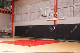 Empty basketball court photos and images. Basketball Hoop On Empty Indoor Court Stock Photo Picture And Royalty Free Image Image 136903023