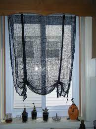 Make Your Own Tie Up Curtains For Halloween With No Sewing I Used Creepy Cloth Fabric From The Doll Tie Up Curtains Primitive Curtains Halloween Inspiration
