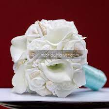 The crystals can be clear or blue and other bling can be added as well. Ocean Treasures Seashell Wedding Bouquet With Roses Calla Lilies And Small Light Shells Sim Calla Lily Bouquet Wedding Blue Wedding Bouquet Wedding Bouquets