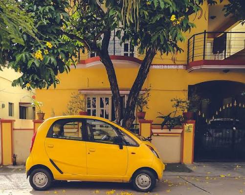 Parked - 2010 Tata Nano _____ Ah, the famous Nano, touted as the world's cheapest new car. It was a brilliant feat of engineering, and had a small 37HP 2-cylinder 624cc engine