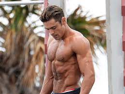 Now, let's be clear, zac efron is notorious for sporting an awesome body in many of his flicks and it's hard to think of a single movie he has done, where his shirt hasn't come off. The Zac Efron Baywatch Body Workout Muscle Fitness