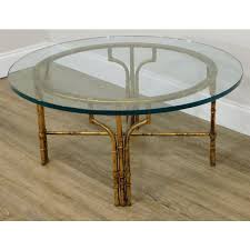 Round tables are easy to move around while square tables pair well with sectionals. Faux Bamboo Gilt Metal Base Round Glass Top Coffee Table Chairish