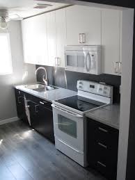 Kitchen Reno Ikea Applad And Gnosjo Cabinets With Salt Pepper Granite Counters And Grey Oak Laminat Laminate Kitchen Laminate Kitchen Cabinets Grey Flooring