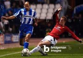 Image of MANCHESTER UNITED'S BUTT AND DEPORTIVO CORUNA'S MANUEL PABLO  BATTLE FOR THE