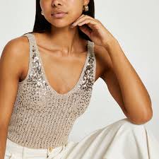 This top is true to size and has an overall relaxed fit. Rose Gold Sequin Stitch Vest River Island