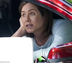 Looking out car window source Jennifer Aniston Films Cake With Sam Worthington And Anna Kendrick Daily Mail Online