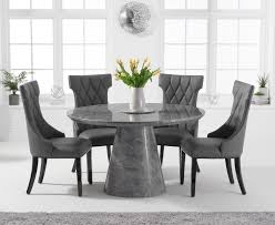 Its tabletop is made from solid fir with a washable lacquered finish. Ravello 130cm Round Grey Marble Dining Table With Freya Chairs